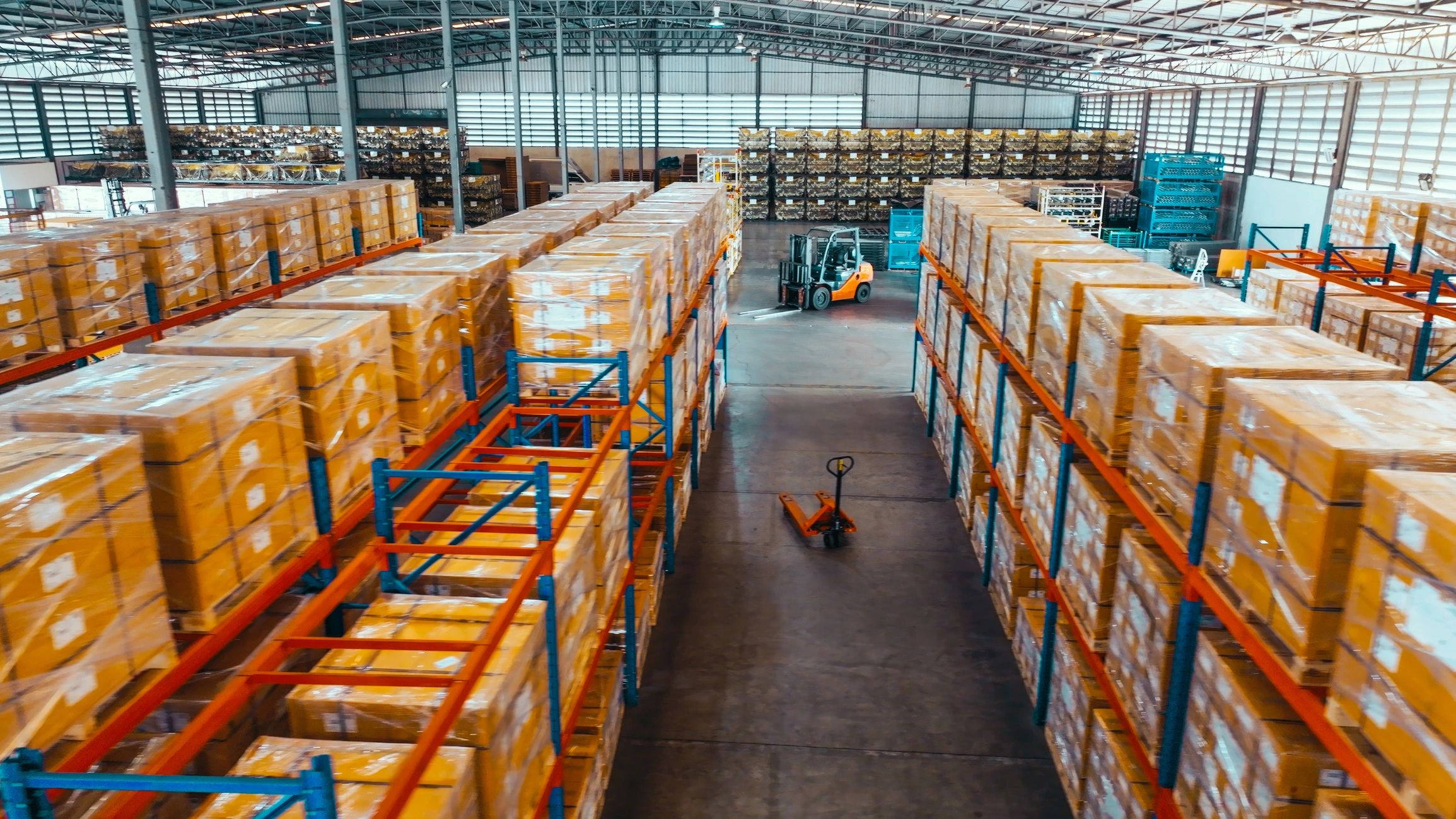 Warehouse shelves with packaged goods representing organized distribution operations